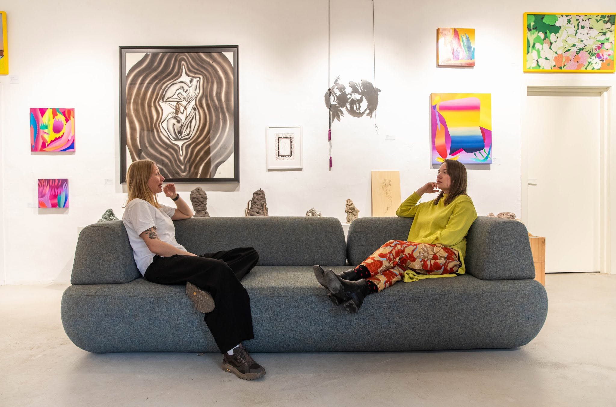 Two people discussing artworks at Kogo Gallery